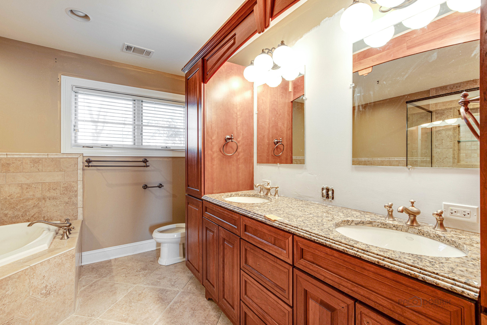 511 Alexander Boulevard Elmhurst, IL 60126 - Photo 27 of 38 a bathroom with a granite countertop sink mirror vanity bathtub and toilet