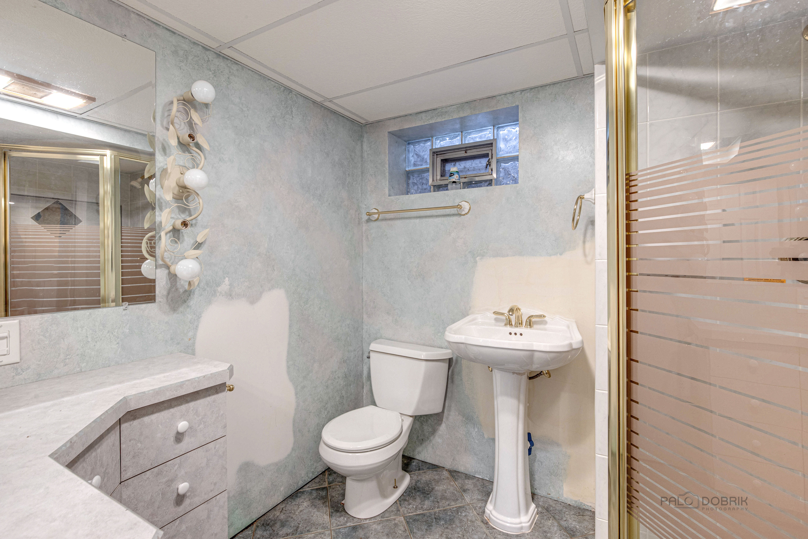 511 Alexander Boulevard Elmhurst, IL 60126 - Photo 31 of 38 a bathroom with a sink a toilet and shower