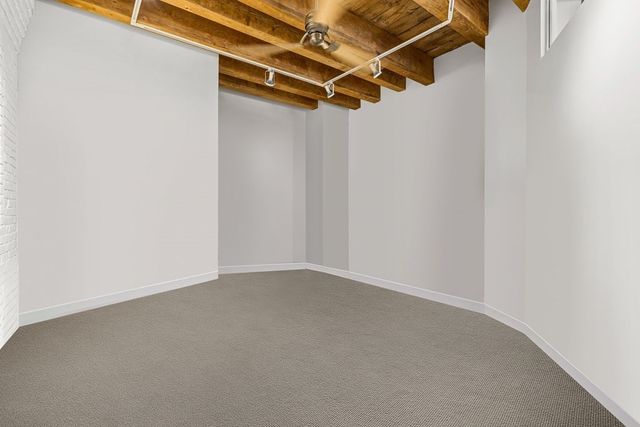 a bathroom with a shower sink and mirror