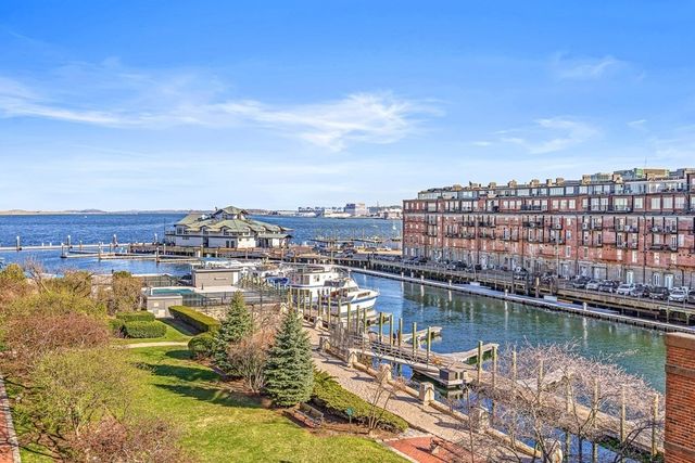 a lobby with furniture and flowers