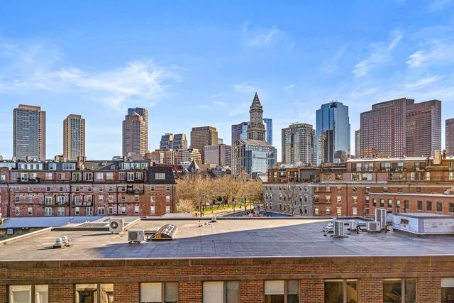 a view of a city with tall buildings