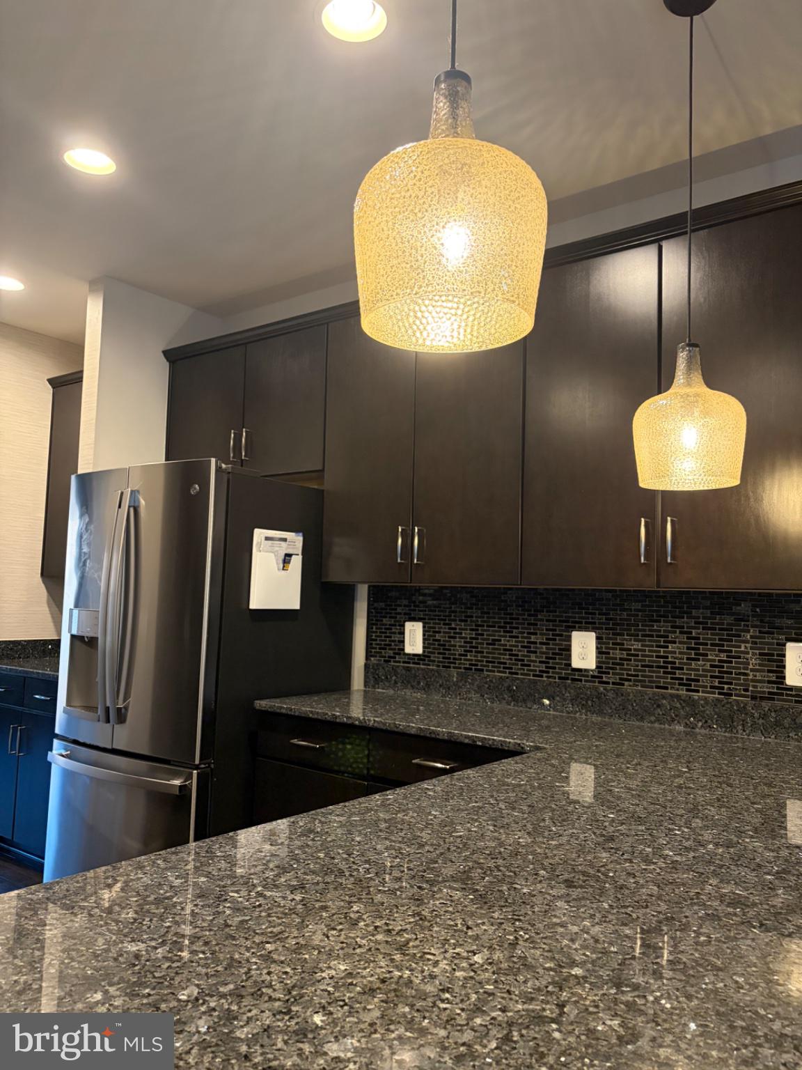 25333 Wakestone Terrace Chantilly, VA 20152 - Photo 102 of 109 Sleek kitchen with modern lighting.