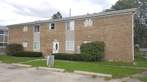 308 Wilshire Drive, Unit 4 Sandwich, IL 60548 - Photo 1 of 9 a view of a house with backyard and garden