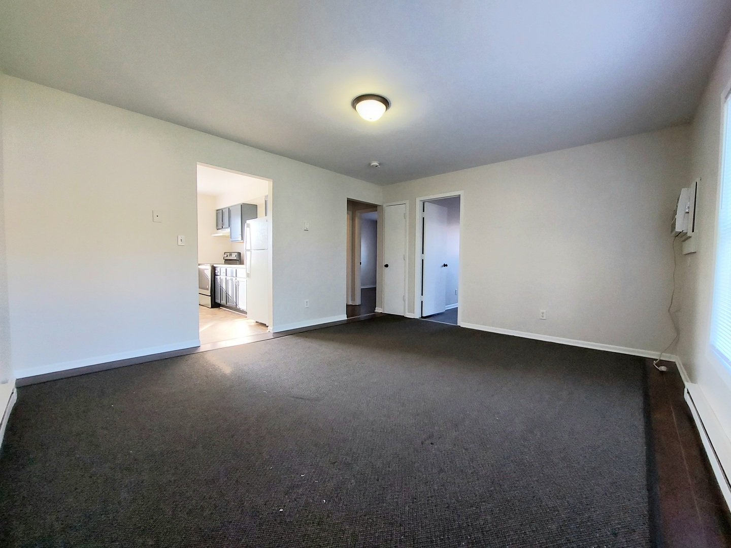 308 Wilshire Drive, Unit 4 Sandwich, IL 60548 - Photo 3 of 9 a view of empty room