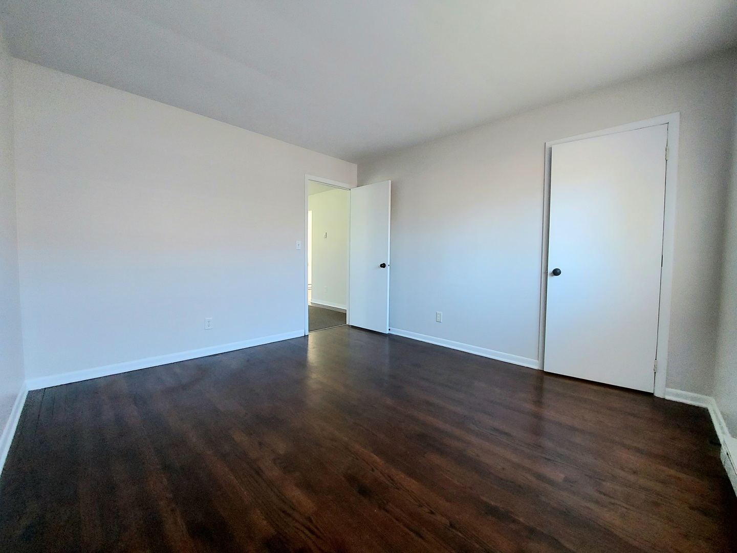 308 Wilshire Drive, Unit 4 Sandwich, IL 60548 - Photo 8 of 9 a view of an empty room and wooden floor