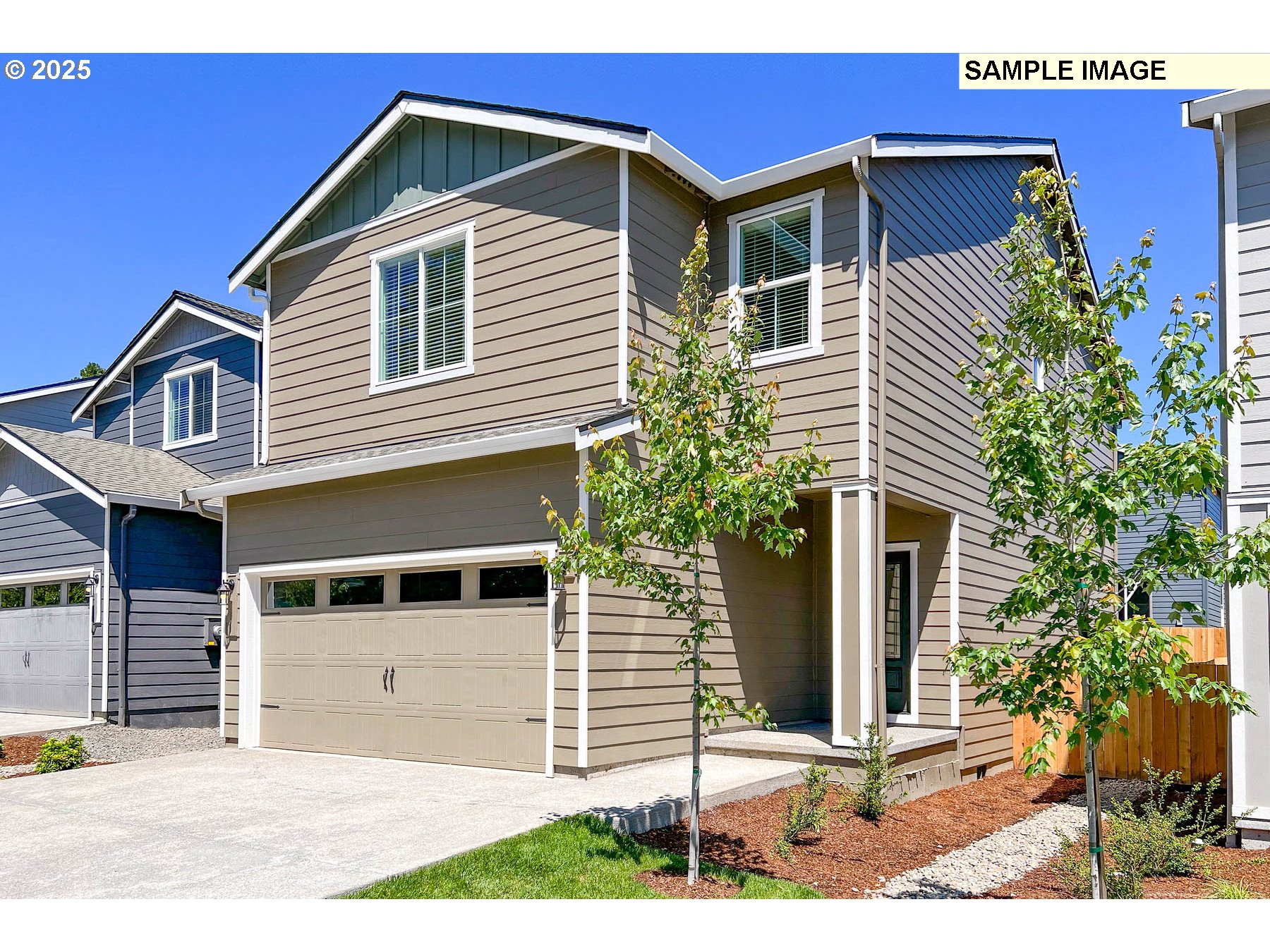 3982 Southwest Duniway Lane Gresham, OR 97080 - Photo 2 of 15 a front view of a house with garden