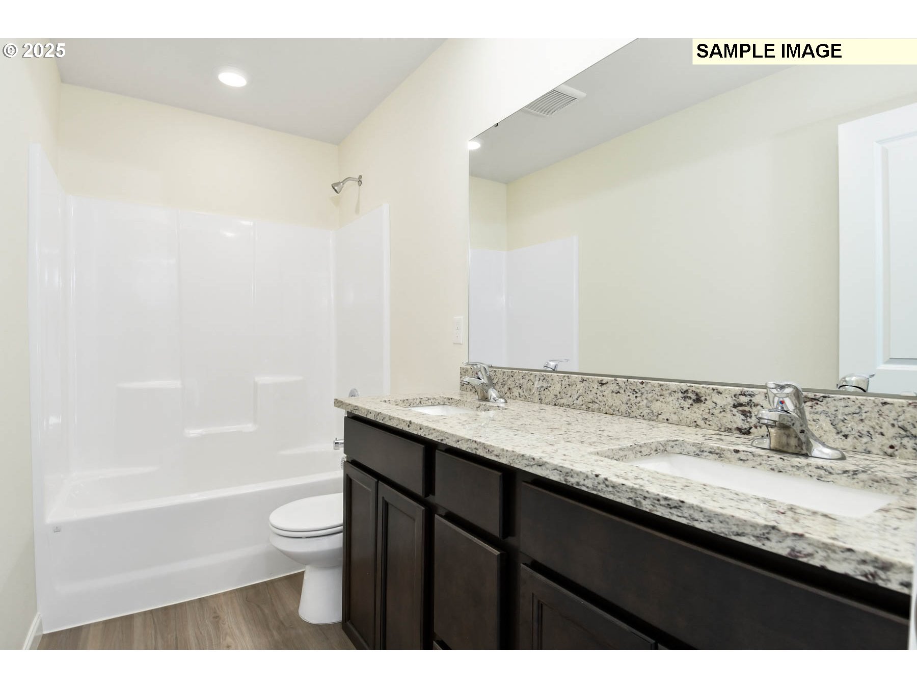 3982 Southwest Duniway Lane Gresham, OR 97080 - Photo 9 of 15 a bathroom with a granite countertop sink a toilet and shower