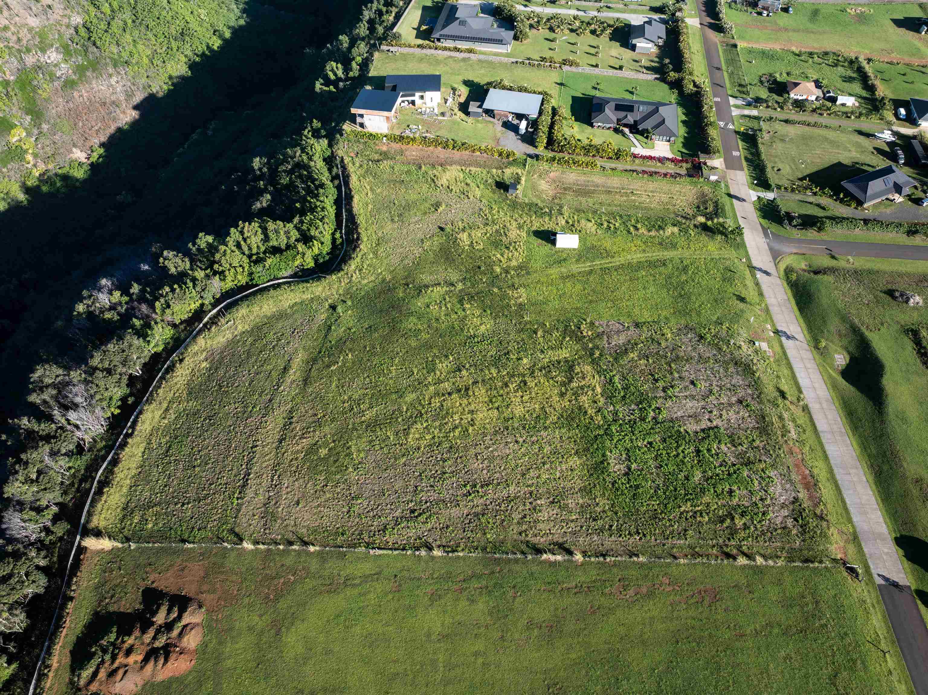 1022 Auwaha Place, Unit A Haiku, HI 96708 - Photo 9 of 26 a aerial view of a residential houses with outdoor space