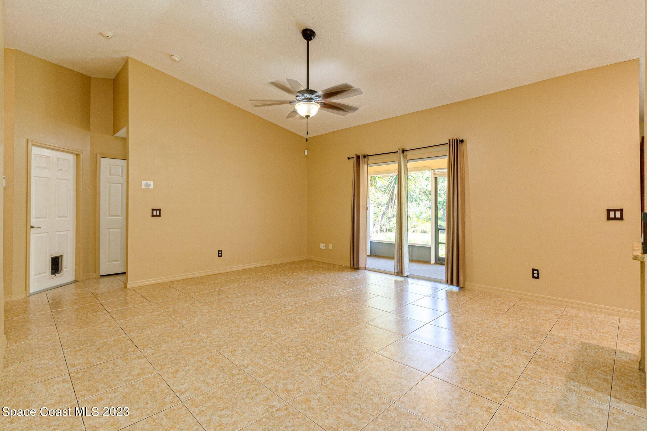 1371 Darrow Road Southwest Palm Bay, FL 32908 - Photo 5 of 21 a view of an empty room with a window