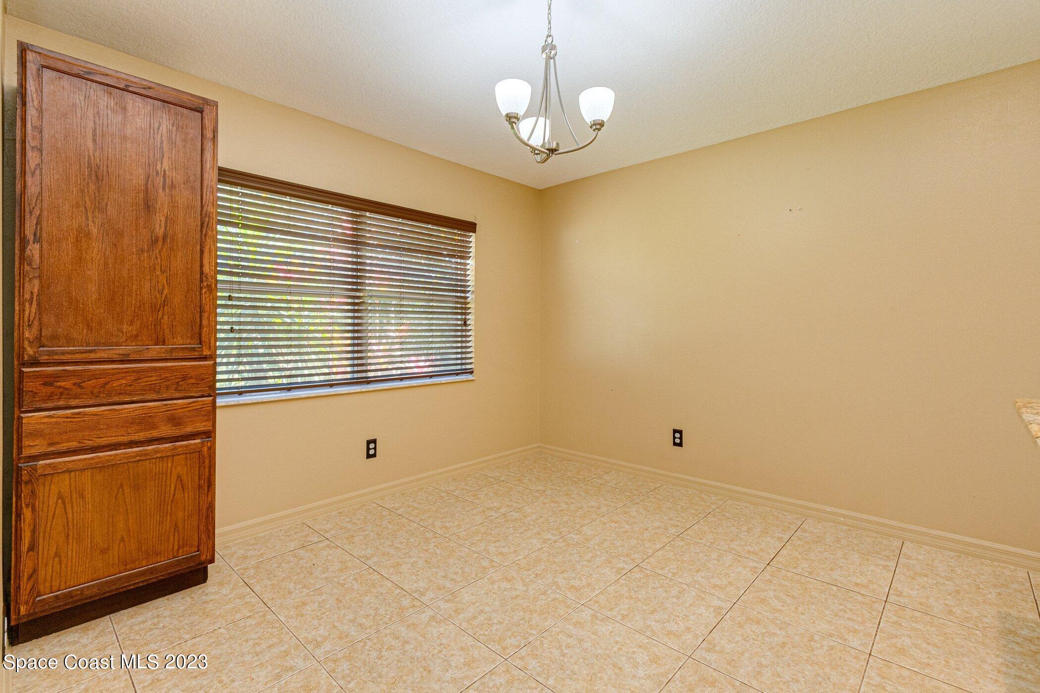 1371 Darrow Road Southwest Palm Bay, FL 32908 - Photo 6 of 21 a view of an empty room with a window