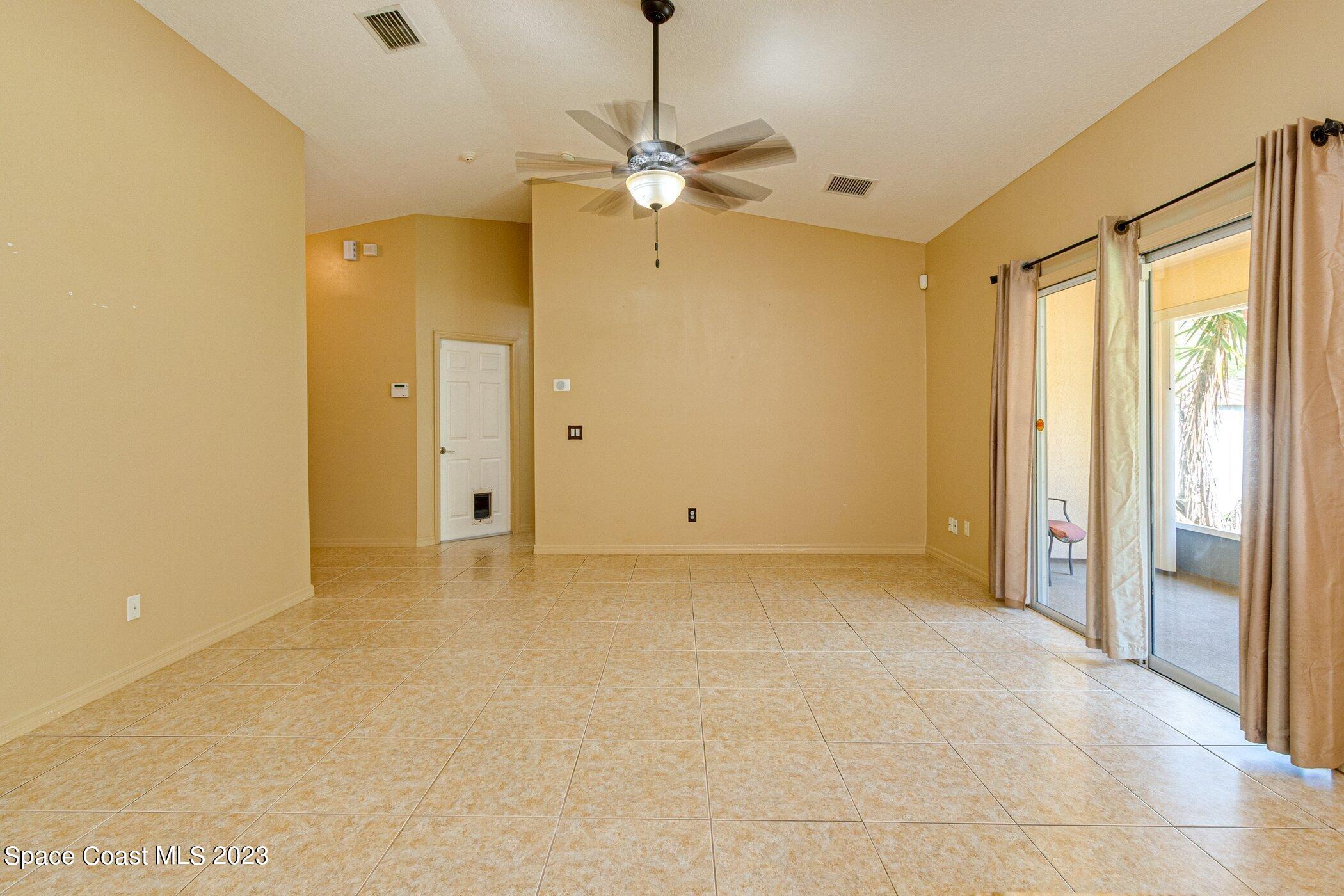 1371 Darrow Road Southwest Palm Bay, FL 32908 - Photo 10 of 21 a view of an empty room with a window