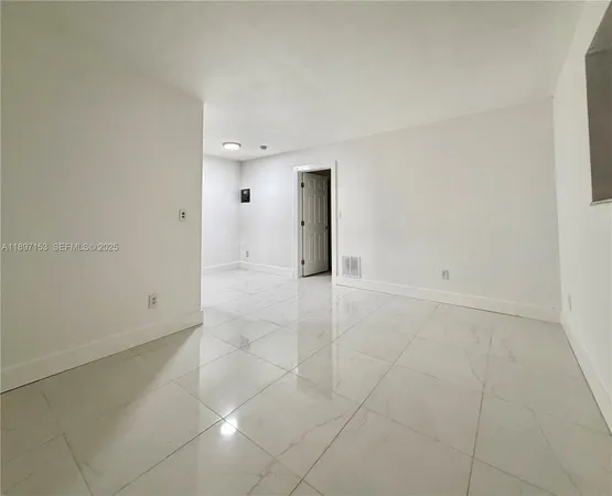 an empty room with glass door