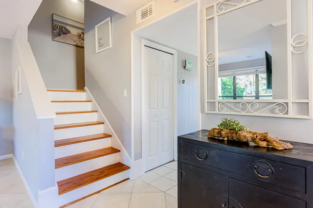 a view of entryway with furniture and staircase