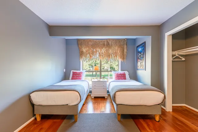 a room with two chairs and a large window