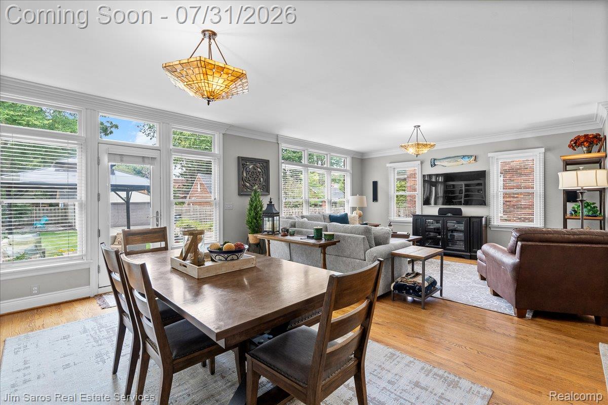 Open-concept living area with wood-finish flooring