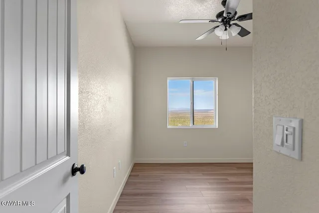 a view of a hallway with a window