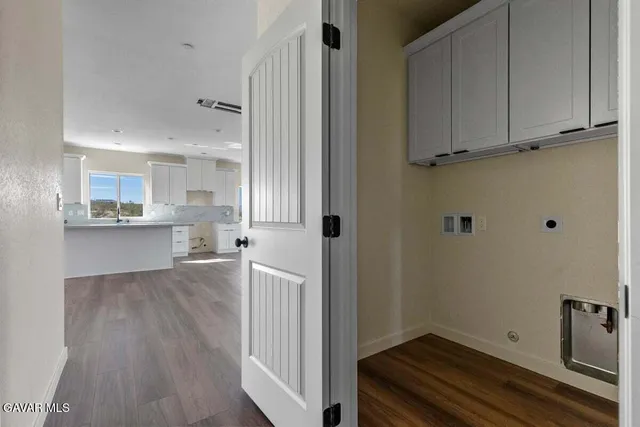 a view of a kitchen with wooden floor