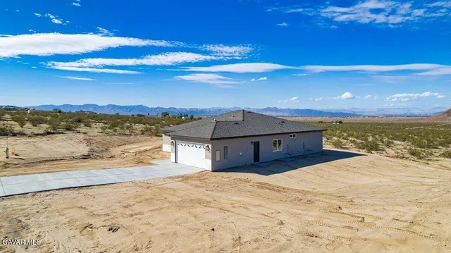 a view of a house with a ocean view