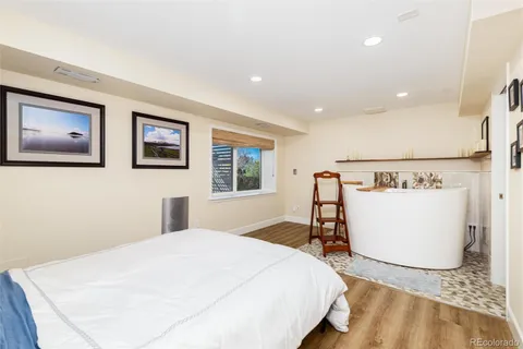 a bedroom with a bed and a desk