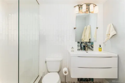 a bathroom with a shower and a shower