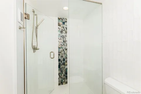 a picture of a bench in front of a wall