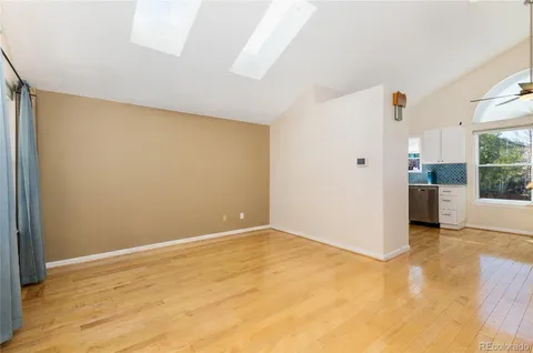 a kitchen with granite countertop a stove a sink and a microwave