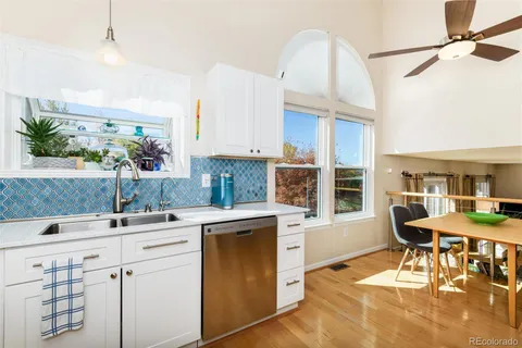 a kitchen with a sink cabinets and window