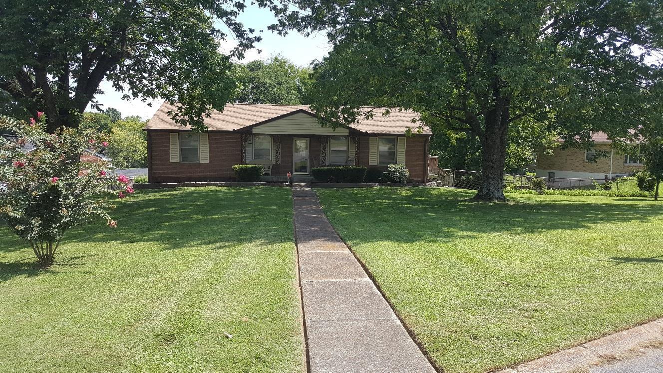 406 Gates Road Goodlettsville, TN 37072 - Photo 1 of 21 a front view of a house with yard
