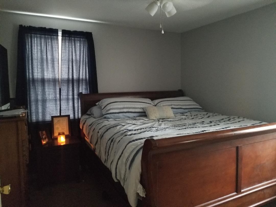 406 Gates Road Goodlettsville, TN 37072 - Photo 16 of 21 a bedroom with a bed and a window