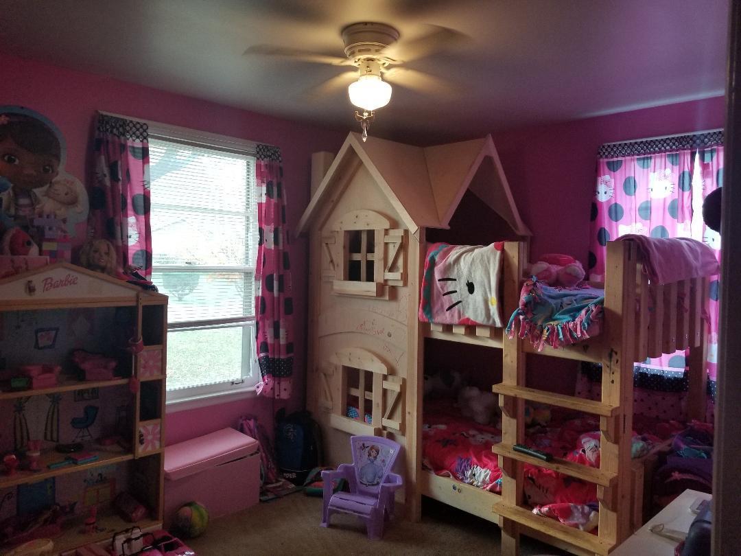 406 Gates Road Goodlettsville, TN 37072 - Photo 19 of 21 a bedroom with a bed and a chandelier