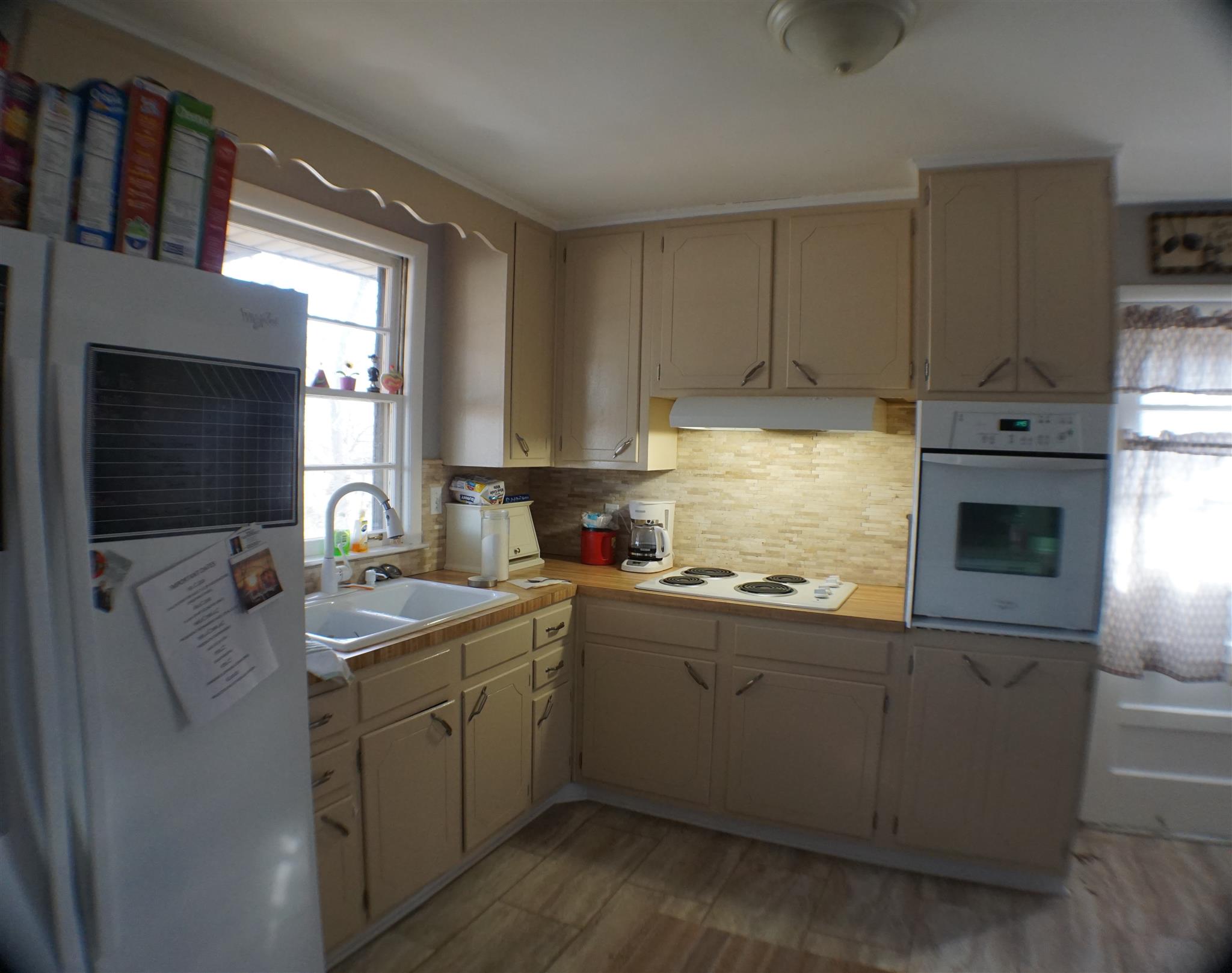 406 Gates Road Goodlettsville, TN 37072 - Photo 8 of 21 a kitchen with a sink cabinets and window