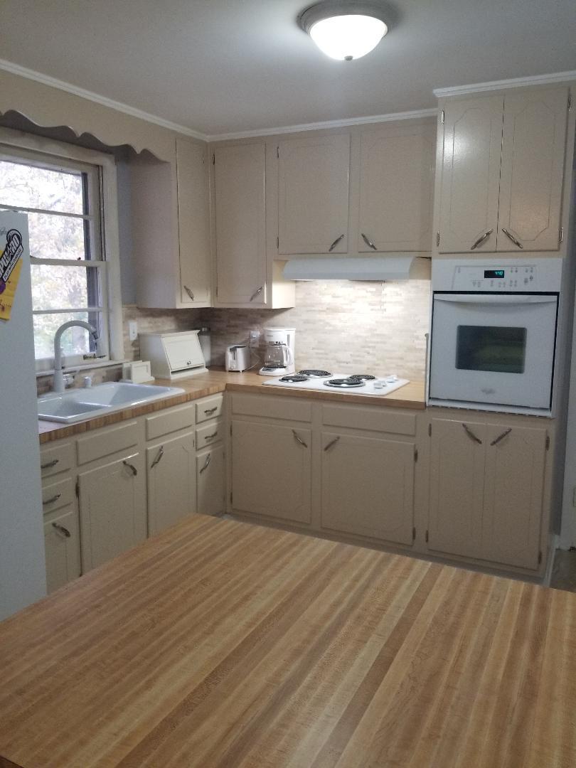 406 Gates Road Goodlettsville, TN 37072 - Photo 10 of 21 a kitchen with a sink a stove and cabinets