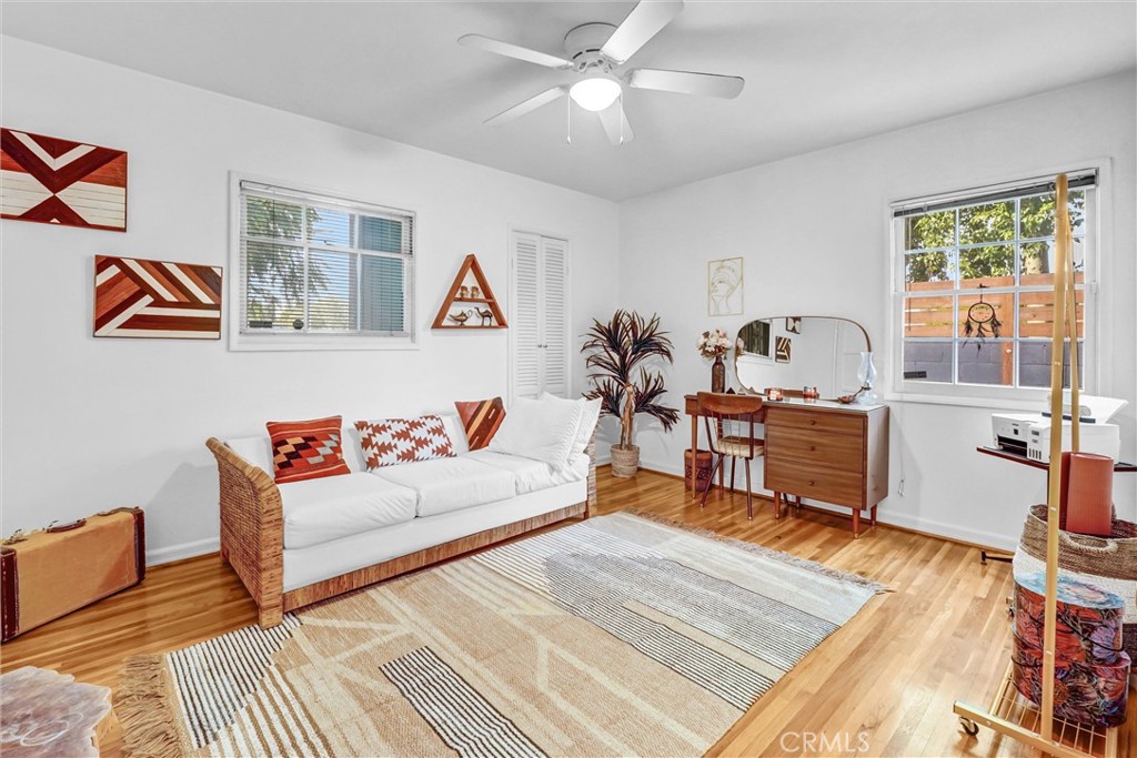 7758 Chimineas Avenue Reseda, CA 91335 - Photo 15 of 35 a living room with furniture a rug and a window