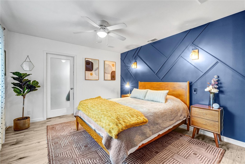 7758 Chimineas Avenue Reseda, CA 91335 - Photo 16 of 35 a bedroom with a bed and a potted plant