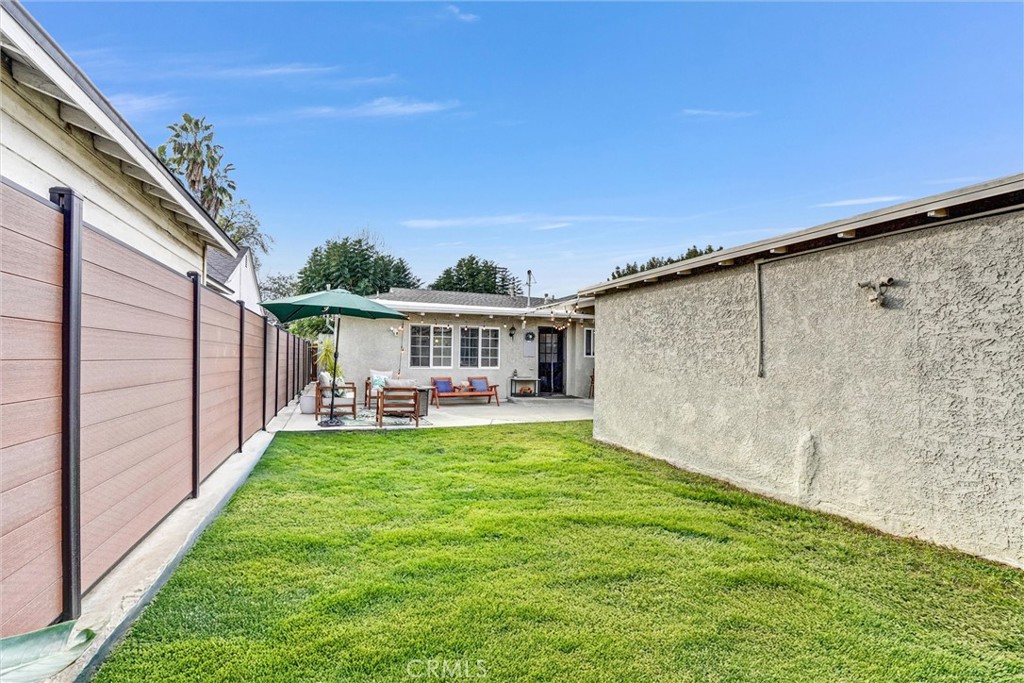7758 Chimineas Avenue Reseda, CA 91335 - Photo 23 of 35 a view of a house with backyard porch and furniture