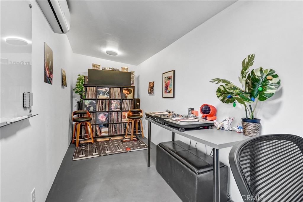 7758 Chimineas Avenue Reseda, CA 91335 - Photo 25 of 35 a bedroom with furniture and a potted plant