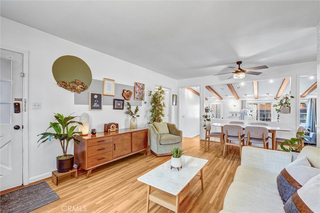 7758 Chimineas Avenue Reseda, CA 91335 - Photo 3 of 35 a living room with lots of furniture and painting on the wall