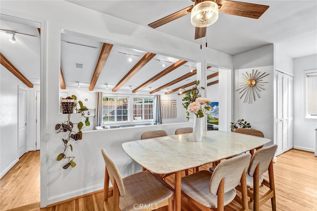 7758 Chimineas Avenue Reseda, CA 91335 - Photo 4 of 35 a view of a dining room with furniture and wooden floor