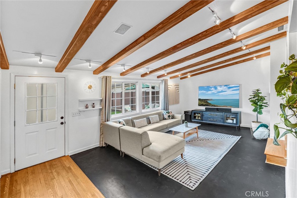 7758 Chimineas Avenue Reseda, CA 91335 - Photo 6 of 35 a living room with furniture and wooden floor