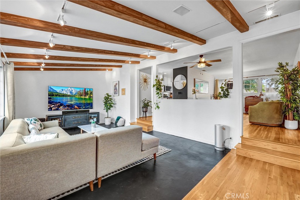 7758 Chimineas Avenue Reseda, CA 91335 - Photo 7 of 35 a living room with furniture and a flat screen tv