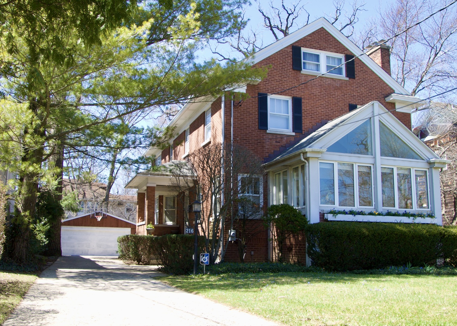 216 Myrtle Street Winnetka, IL 60093 - Photo 1 of 74 a front view of a house with a yard