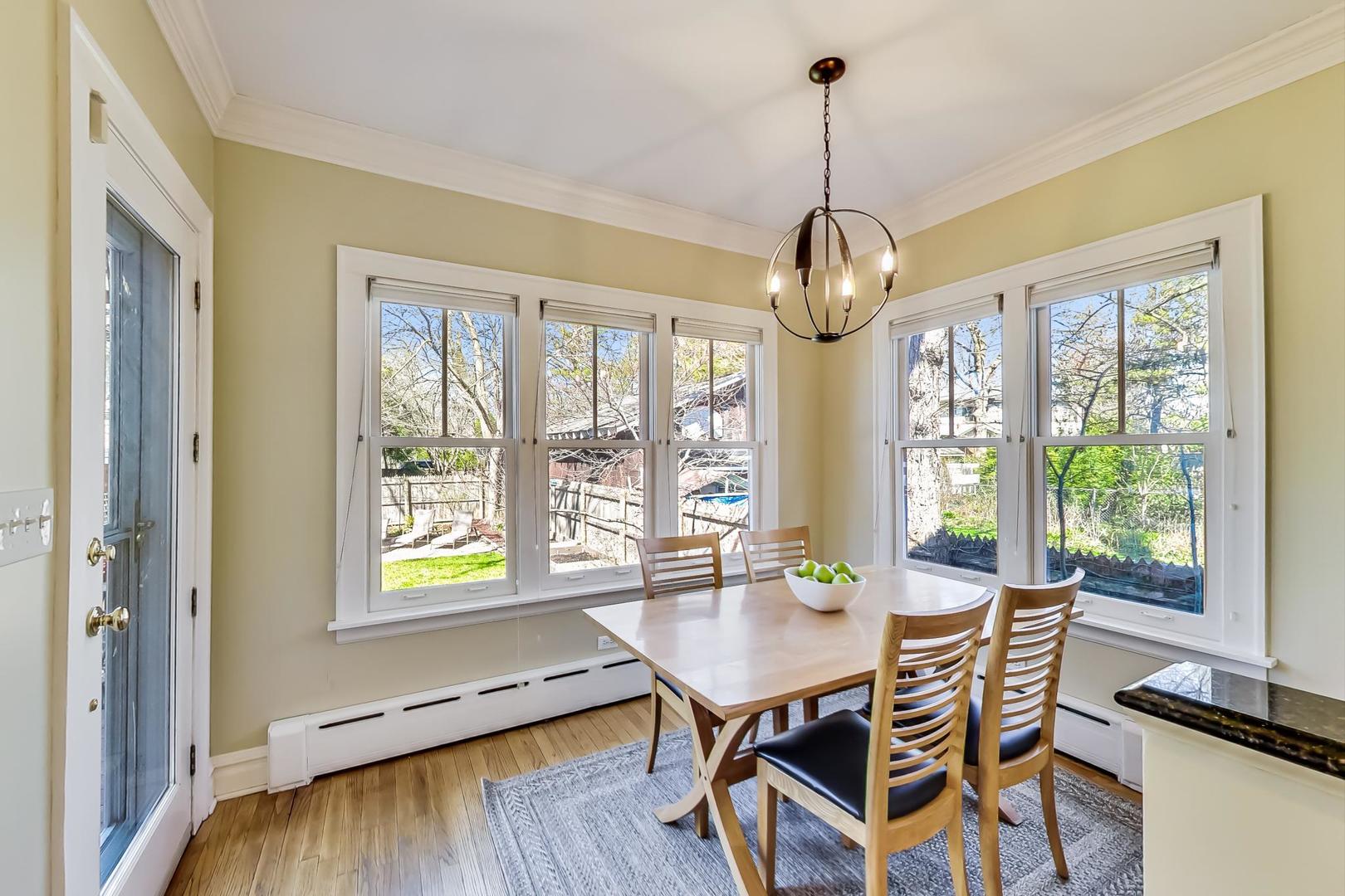 216 Myrtle Street Winnetka, IL 60093 - Photo 23 of 74 a view of a dining room with furniture window and outside view