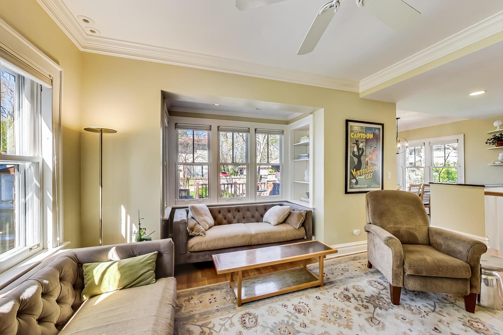 216 Myrtle Street Winnetka, IL 60093 - Photo 24 of 74 a living room with furniture and a large window