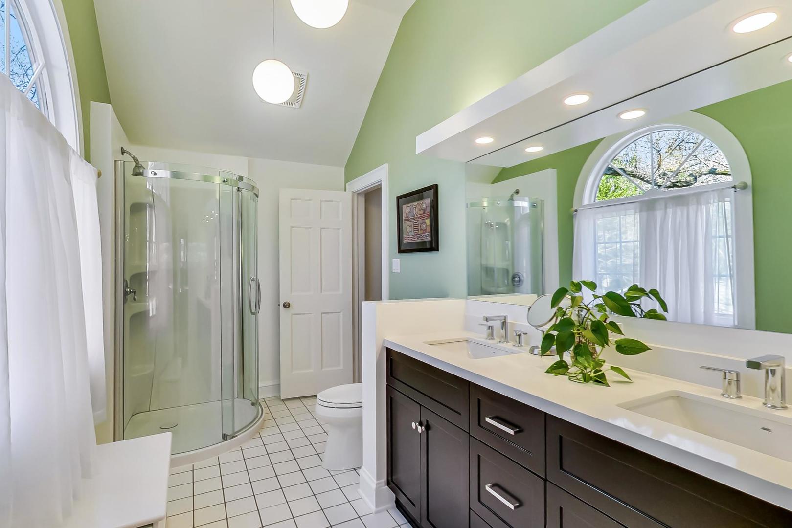 216 Myrtle Street Winnetka, IL 60093 - Photo 40 of 74 a bathroom with a double vanity sink mirror and shower