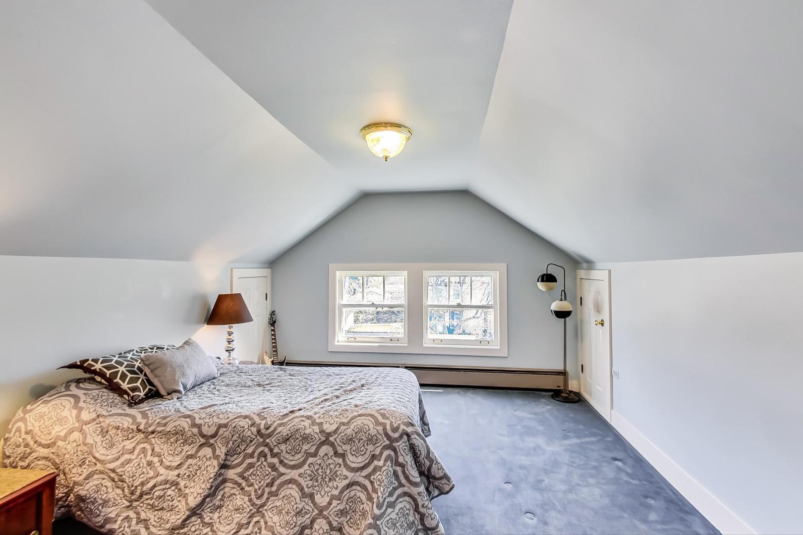 216 Myrtle Street Winnetka, IL 60093 - Photo 47 of 74 a bedroom with a bed and a window
