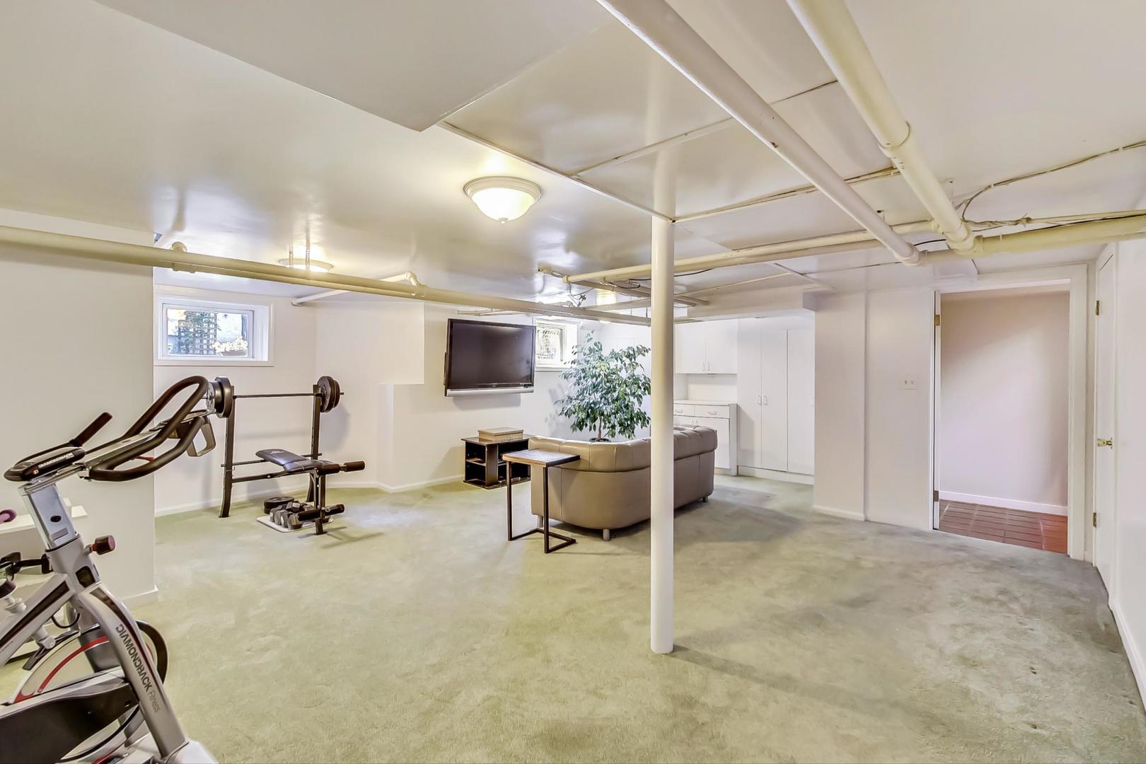 216 Myrtle Street Winnetka, IL 60093 - Photo 54 of 74 a view of a room with gym equipment