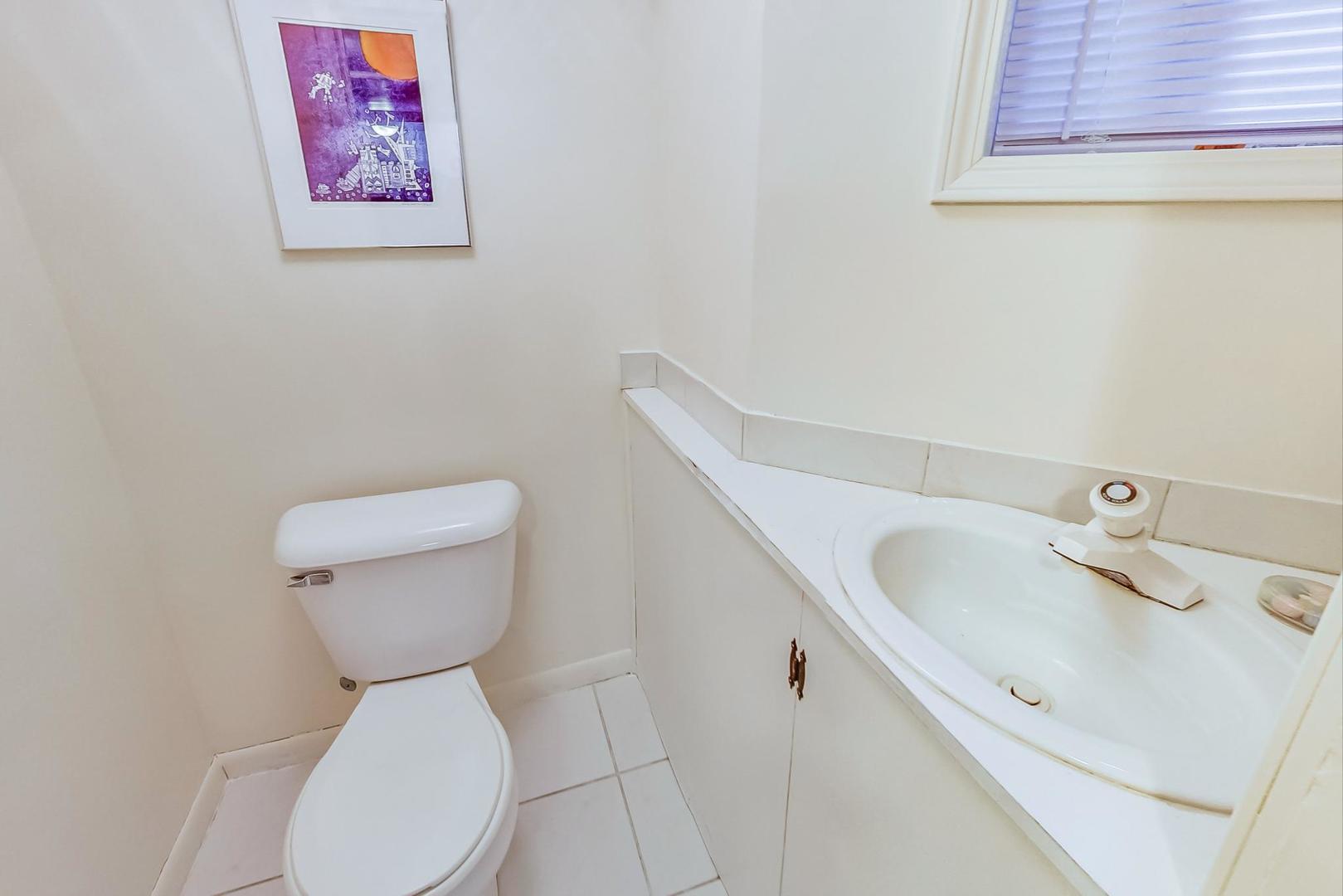 216 Myrtle Street Winnetka, IL 60093 - Photo 58 of 74 a white toilet sitting next to a bathroom sink