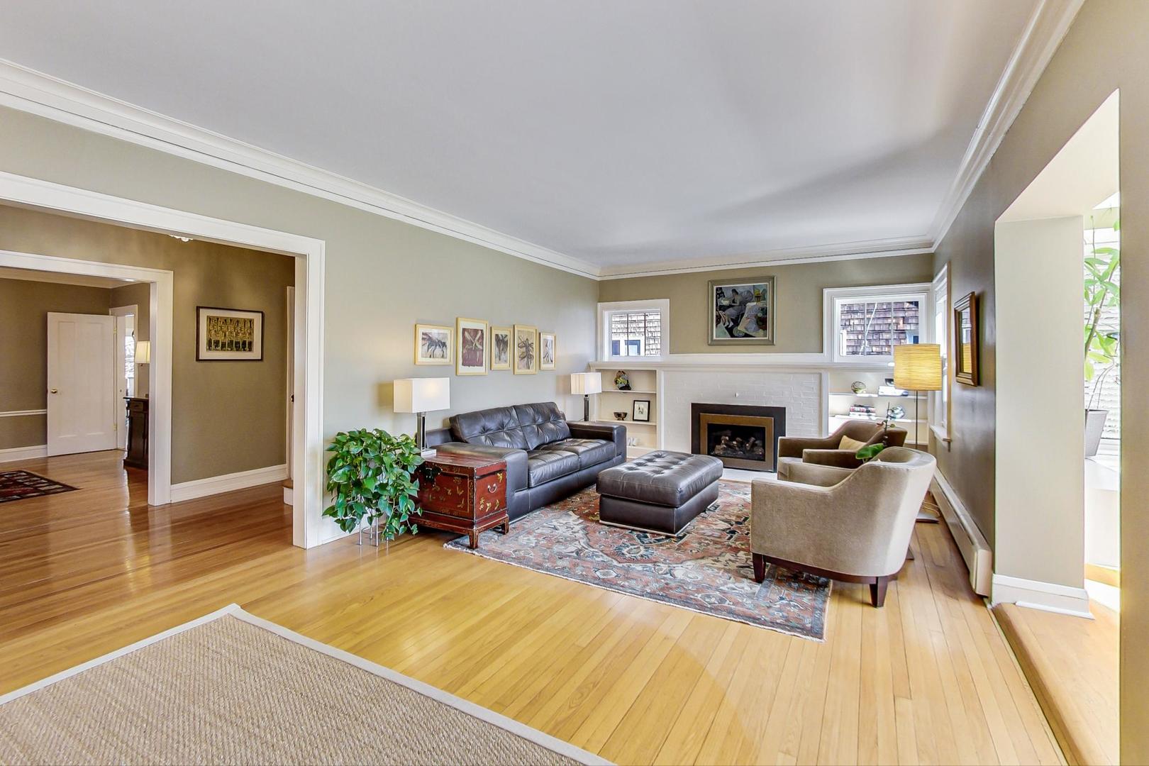 216 Myrtle Street Winnetka, IL 60093 - Photo 6 of 74 a living room with furniture fireplace and a window