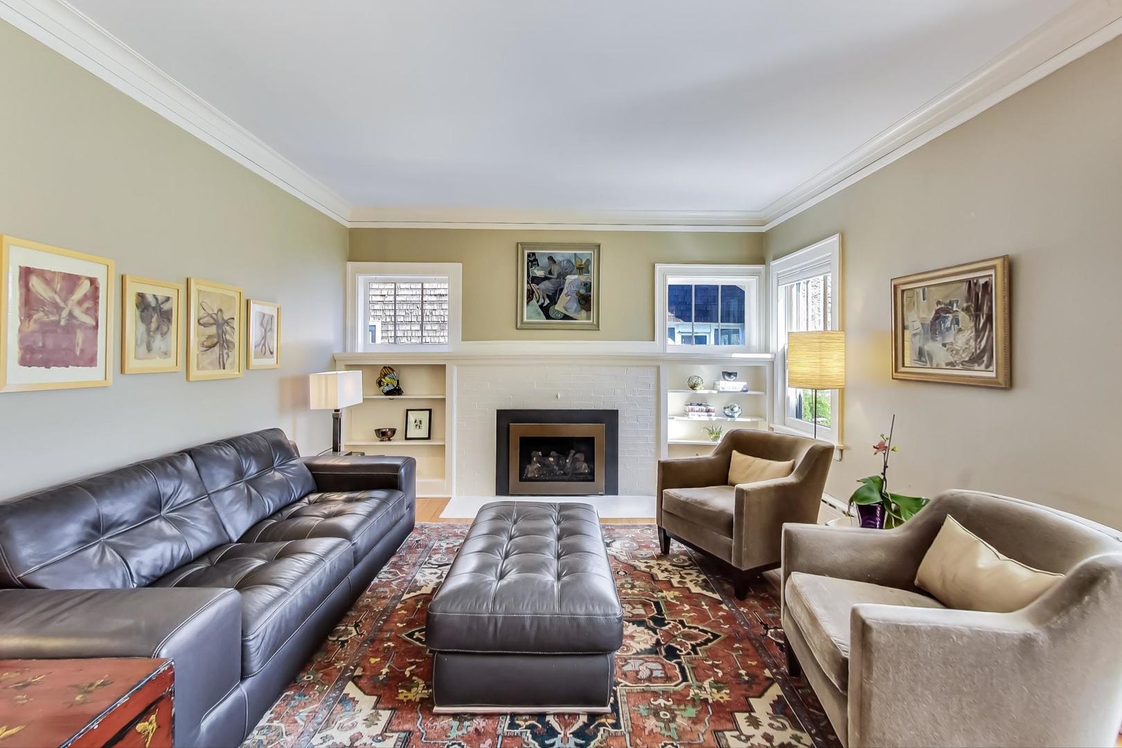216 Myrtle Street Winnetka, IL 60093 - Photo 7 of 74 a living room with furniture and a fireplace
