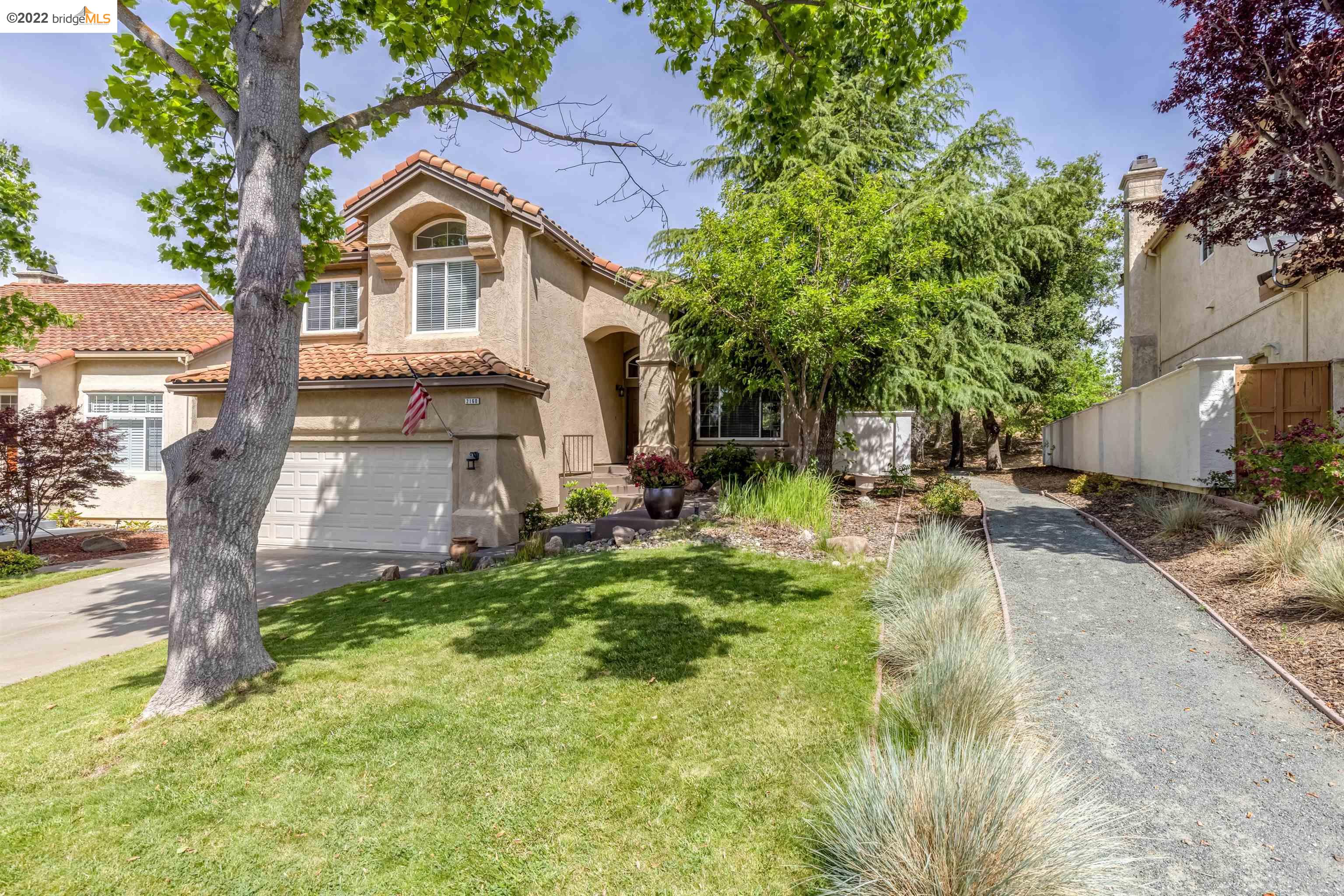 Undisclosed Address Concord, CA 94521 - Photo 2 of 47 a front view of a house with a yard